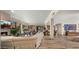 Inviting living area with stacked stone fireplace and comfortable seating with access to backyard at 4450 E Camelback Rd # 4, Phoenix, AZ 85018