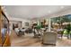 Spacious living room featuring a modern fireplace, comfortable seating, and large windows at 4450 E Camelback Rd # 4, Phoenix, AZ 85018