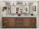 Lovely main bathroom featuring double sinks and a large mirror at 4450 E Camelback Rd # 4, Phoenix, AZ 85018