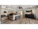 Bright main bedroom featuring wood-look floors, a ceiling fan, and a TV at 4450 E Camelback Rd # 4, Phoenix, AZ 85018