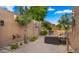 Private patio with lounge area and desert landscaping at 4450 E Camelback Rd # 4, Phoenix, AZ 85018