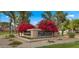 Community entrance sign with vibrant bougainvillea and desert landscaping at 4450 E Camelback Rd # 4, Phoenix, AZ 85018