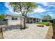 Spacious backyard featuring a brick patio, mature trees, and covered seating area at 508 S Ernie Pl, Tempe, AZ 85281
