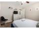 Well-lit bedroom featuring a ceiling fan, carpeted floors, a TV, and closet space at 508 S Ernie Pl, Tempe, AZ 85281