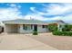Welcoming single-story home featuring desert landscaping, driveway, and a charming blue front door at 508 S Ernie Pl, Tempe, AZ 85281