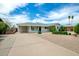 Inviting single-story home with desert landscaping, an attached carport, and a welcoming entrance at 508 S Ernie Pl, Tempe, AZ 85281