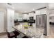 Modern kitchen featuring stainless steel appliances, a large island, and white cabinetry at 508 S Ernie Pl, Tempe, AZ 85281