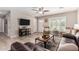 Inviting living room with wood-look tile flooring, plantation shutters, and comfortable seating at 508 S Ernie Pl, Tempe, AZ 85281