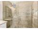 Tiled walk-in shower with glass door and a built-in seat in this modern bathroom at 508 S Ernie Pl, Tempe, AZ 85281