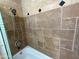 Shower with travertine tile and shower head at 5338 W Wolf St, Phoenix, AZ 85031