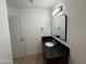 Bathroom with granite vanity and updated fixtures at 5338 W Wolf St, Phoenix, AZ 85031