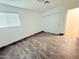 Bedroom featuring wood-look floors, a window with blinds, and a closet with sliding doors at 5338 W Wolf St, Phoenix, AZ 85031