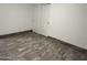 Bedroom with hardwood floors and closet at 5338 W Wolf St, Phoenix, AZ 85031