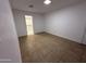 A spare bedroom has tiled floors and an adjoining walk-in closet at 5338 W Wolf St, Phoenix, AZ 85031