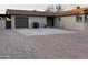A spacious driveway featuring brick accents and a two-car garage enhances the home's curb appeal at 5338 W Wolf St, Phoenix, AZ 85031