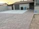 Brick driveway leading to a two-car garage with ample parking space for residents and guests at 5338 W Wolf St, Phoenix, AZ 85031