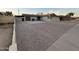 A single-story home has desert landscaping, brick driveway, and an attached garage at 5338 W Wolf St, Phoenix, AZ 85031