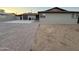 A single-story home boasts desert landscaping, a brick driveway, and an attached garage at 5338 W Wolf St, Phoenix, AZ 85031