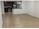 Open living room and kitchen featuring tile floors, stainless steel appliances, and granite countertops at 5338 W Wolf St, Phoenix, AZ 85031