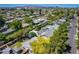 Overhead view of a residential area featuring houses with backyards, pools, and lush greenery at 534 W 15Th St, Tempe, AZ 85281
