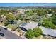 Overhead view of a home featuring solar panels, landscaping and tree lined street within a lush community at 534 W 15Th St, Tempe, AZ 85281