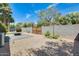 Backyard with a fire pit area, gravel, block wall, and privacy landscaping at 534 W 15Th St, Tempe, AZ 85281