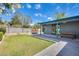 Spacious backyard with patio, lawn, mature trees, and privacy fence offers outdoor enjoyment at 534 W 15Th St, Tempe, AZ 85281