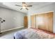 Bright bedroom with ceiling fan, wood-look flooring, and ample closet space at 534 W 15Th St, Tempe, AZ 85281