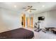 Spacious bedroom with wood-look flooring, a ceiling fan, and a TV at 534 W 15Th St, Tempe, AZ 85281