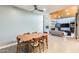 Open floorplan showcases a dining table and living room with stone fireplace, and offers ample space for both dining and relaxation at 534 W 15Th St, Tempe, AZ 85281