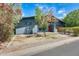 Inviting exterior featuring a blue-gray facade, a red front door, and vibrant landscaping at 534 W 15Th St, Tempe, AZ 85281