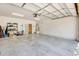 Spacious and clean garage with epoxy flooring, overhead lighting, and storage racks at 534 W 15Th St, Tempe, AZ 85281