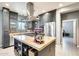 An island with seating and stainless steel appliances in a well-lit, modern kitchen at 534 W 15Th St, Tempe, AZ 85281