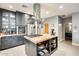 An island with a range and granite countertops in a well-equipped, modern kitchen at 534 W 15Th St, Tempe, AZ 85281