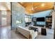 Open-concept living space features a floor-to-ceiling stone fireplace and well-appointed furniture with a bright, inviting ambiance at 534 W 15Th St, Tempe, AZ 85281