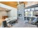 Inviting open living space with a stone fireplace, bar area, and modern furnishings, perfect for entertaining guests at 534 W 15Th St, Tempe, AZ 85281