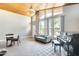 Bright living area featuring a vaulted wood ceiling, large windows, and comfortable seating, perfect for relaxation and entertaining at 534 W 15Th St, Tempe, AZ 85281