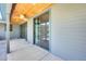 Covered patio with stained wood ceiling, fan, and large sliding doors to indoor spaces at 534 W 15Th St, Tempe, AZ 85281