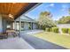 Covered patio with a dining table, wooden ceiling, and landscaped backyard views at 534 W 15Th St, Tempe, AZ 85281