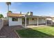 Charming backyard with lush grass, rock landscaping and covered patio at 6873 E Kathleen Rd, Scottsdale, AZ 85254