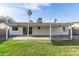 Spacious backyard featuring a covered patio and a well-maintained lawn at 6873 E Kathleen Rd, Scottsdale, AZ 85254