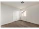 Cozy bedroom featuring carpeted floor, a window, and built-in closet at 6873 E Kathleen Rd, Scottsdale, AZ 85254