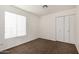 Clean bedroom with carpeted floor, window and a closet at 6873 E Kathleen Rd, Scottsdale, AZ 85254