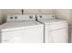 Laundry appliances are ready to use, with white washer and dryer at 6873 E Kathleen Rd, Scottsdale, AZ 85254