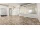 Spacious living room featuring neutral tile floors and a large mirror wall, perfect for entertaining guests at 6873 E Kathleen Rd, Scottsdale, AZ 85254
