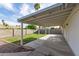 Spacious covered patio and backyard with privacy wall and well maintained lawn at 6873 E Kathleen Rd, Scottsdale, AZ 85254