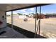 View of the back lot from the porch, including a fire pit and chain link fence at 6950 W Karen Lee Ln, Peoria, AZ 85382