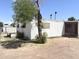 White mobile home with attached screen porch on large lot, surrounded by chain link fencing at 6950 W Karen Lee Ln, Peoria, AZ 85382