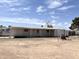 Mobile home exterior featuring a covered porch and a large lot with desert landscaping at 6950 W Karen Lee Ln, Peoria, AZ 85382