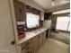 Functional kitchen features a double basin sink, updated appliances, and ample cabinet space at 6950 W Karen Lee Ln, Peoria, AZ 85382